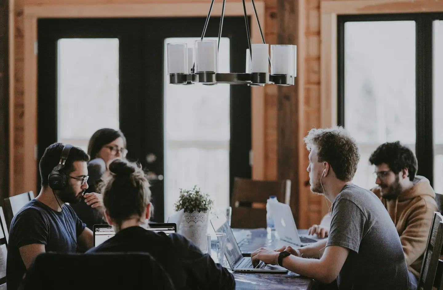 Small team working together at a wooden table